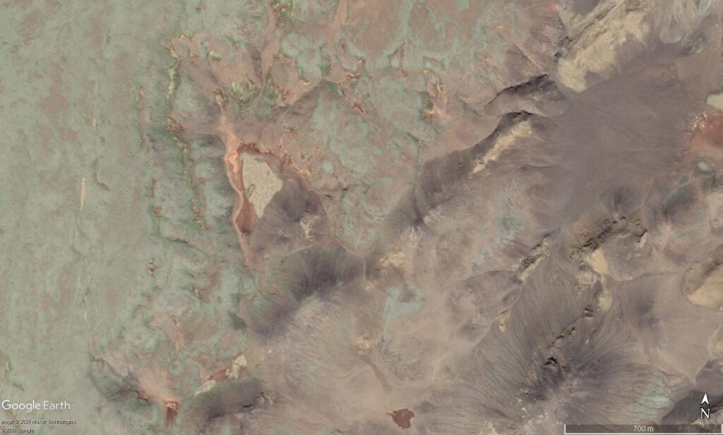 The Geldingadalur valley seen from above with Google Earth. Small valley with small mountains on most sides.