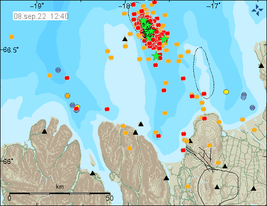 A lot of green stars showing earthquakes over magnitude 3,0 east of Grímsey island and more red and orange dots showing smaller earthquakes. The map is brown for land mass and blue for ocean area, were the earthquake swarm is taking place